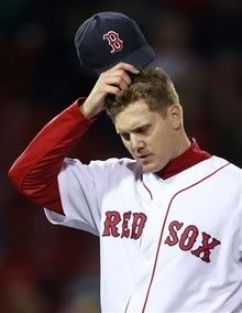 In this Sept. 21, 2010, file photo, Boston Red Sox closer Jonathan Papelbon scratches his head as he walks off the mound after giving up four earned runs to the Baltimore Orioles in a baseball game at Fenway Park in Boston.