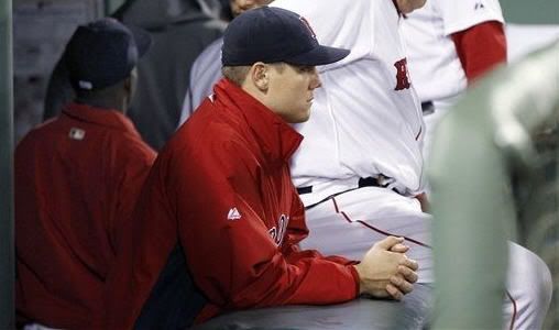 Boston Red Sox relief pitcher Jonathan Papelbon sits in the dugout after the Red Sox lost 7-5 to the Baltimore Orioles in a baseball game at Fenway Park in Boston, Tuesday, Sept. 20, 2011. Papelbon gave up a three-run double to Robert Andino in the eighth inning. 