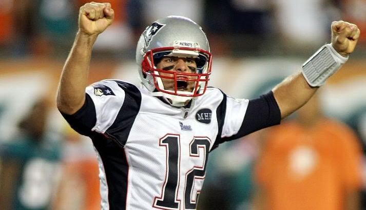 Quarterback Tom Brady #12 of the New England Patriots celebrates a touchdown against the Miami Dolphins at Sun Life Stadium on September 12, 2011 in Miami Gardens, Florida.