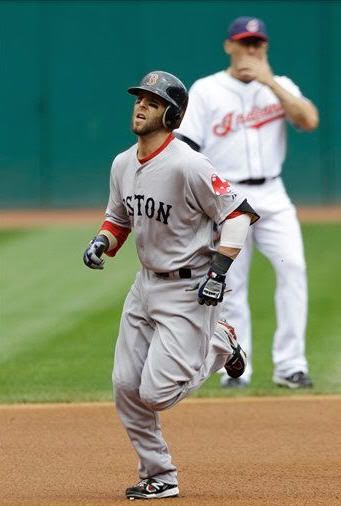 Boston Red Sox's Dustin Pedroia rounds the bases after hitting a two-run home run in the first inning of a baseball game against the Cleveland Indians, Wednesday, May 25, 2011, in Cleveland.