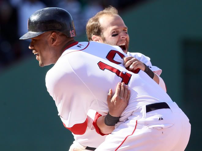 Carl Crawford(notes) #13 is congratulated by teammate Dustin Pedroia(notes) #15 of the Boston Red Sox after Crawford drove in the game winning run in the bottom of the ninth inning against the Seattle Mariners on May 1, 2011 at Fenway Park in Boston, Massachusetts. The Boston Red Sox defeated the Seattle Mariners 3-2. 