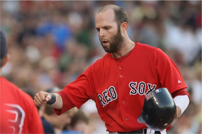 Dustin Pedroia(notes) #15 of the Boston Red Sox is congratulated by teammates after he scored a run in the first inning against the Seattle Mariners on July 22, 2011 at Fenway Park in Boston, Massachusetts. 