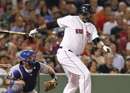 Boston Red Sox designated hitter David Ortiz(notes) follows through on a double scoring two runs as Kansas City Royals catcher Matt Treanor(notes), left, watches during the third inning of a baseball game, Tuesday, July 26, 2011, at Fenway Park in Boston.
