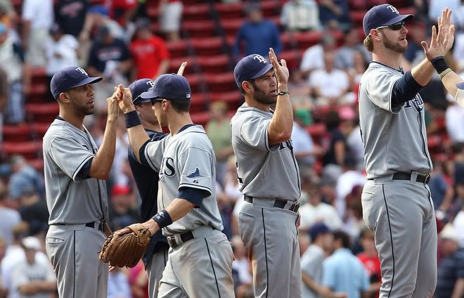 Members of the Tampa Bay Rays celebrate a 4-0 win against the Boston Red Sox at Fenway Park on August 17, 2011 in Boston, Massachusetts.