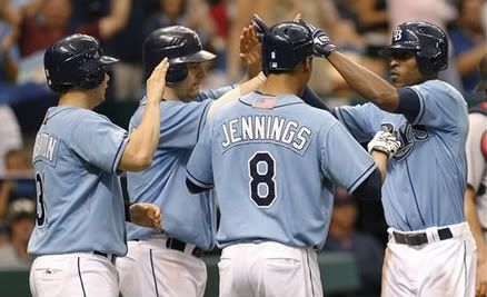Tampa Bay Rays' B.J. Upton(notes) celebrates with teammates after hitting a grand slam during the fifth inning of a baseball game against the Boston Red Sox on Sunday, Sept. 11, 2011, in St. Petersburg, Fla.