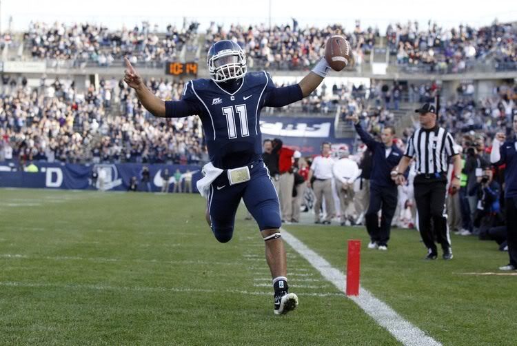 Connecticut Huskies quarterback Scott McCummings (11) celebrates after scoring a touchdown in the third quarter against the Rutgers Scarlet Knights at Rentschler Field.