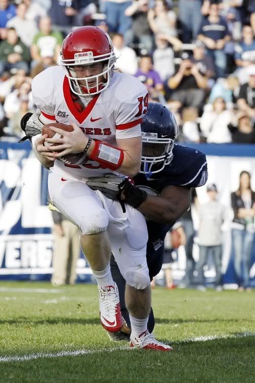 Rutgers Scarlet Knights quarterback Chas Dodd (19) is sacked in the second half Connecticut Huskies defensive end Trevardo Williams (48) at Rentschler Field.