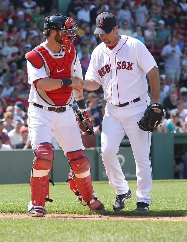 : Tim Wakefield(notes) #49 of the Boston Red Sox is congratulated by Jarrod Saltalamacchia(notes) #39 of the Boston Red Sox after Wakefield earned his two thousand strikeout as a pitcher for the Red Sox during a game against the Seattle Mariners at Fenway Park on July 24, 2011 in Boston, Massachusetts. 
