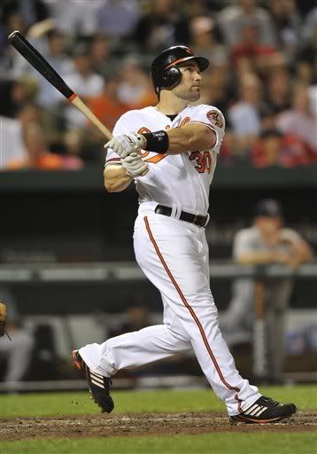 Baltimore Orioles' Luke Scott(notes) follows through on a two-run home run against the Boston Red Sox in the fourth inning of a baseball game, Wednesday, April 27, 2011, in Baltimore.