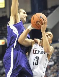 UConn's Shabazz Napier gets fouled on the way to the basket against Holy Cross at the XL Center Sunday afternoon