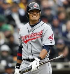 Cleveland Indians Shin-Soo Choo walks back to the dug-out during an MLB American League baseball game in Detroit, Michigan in this April 9, 2010 file photo. The South Korean slugger agreed to a one-year contract with Major League Baseball's Cleveland Indians and avoided salary arbitration, the team said on Tuesday. The team did not disclose financial terms of the deal but local media reported Choo, who batted .300 with 22 homers, 90 RBIs and 22 stolen bases last season, received a huge raise with his salary jumping to $3.97 million from $461,100.