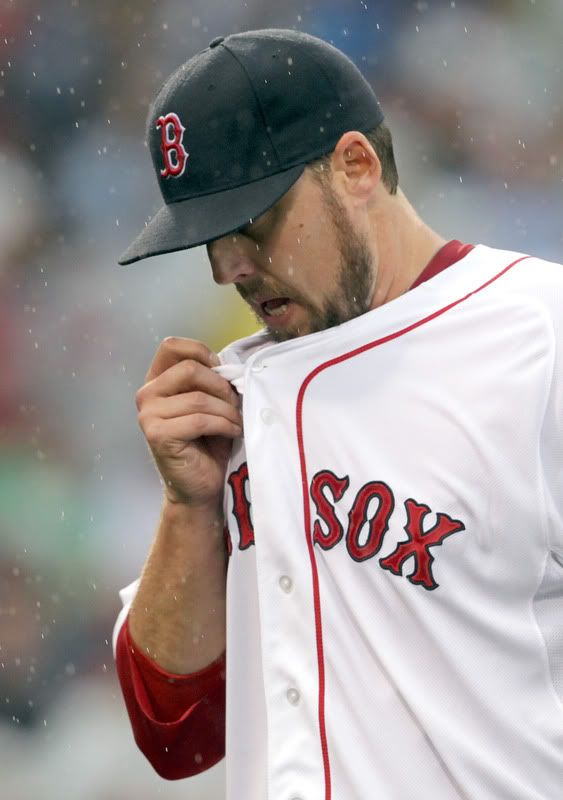 : John Lackey(notes) #41 of the Boston Red Sox reacts after being removed from a game against the San Diego Padres at Fenway Park on June 22, 2011 in Boston, Massachusetts. The go-ahead run scored on the play. 