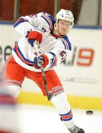 NY Rangers' Tim Erixon takes a shot during the NHL hockey match between Anaheim Ducks and NY Rangers in Stockholm, Sweden, Saturday Oct. 8, 2011.