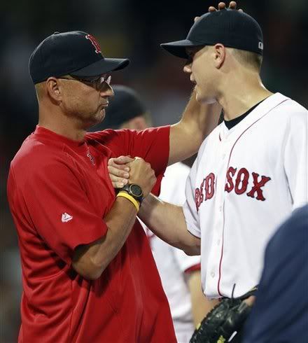 Boston Red Sox manager Terry Francona, left, celebrates with closer Jonathan Papelbon(notes) after defeating the Seattle Mariners 3-1 in a baseball game in Boston, Saturday, July 23, 2011. The game was Francona's 1000th win as a manager.