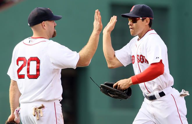 Kevin Youkilis(notes) #20 and Jacoby Ellsbury(notes) #2 of the Boston Red Sox celebrate the win over the Minnesota Twins on May 8, 2011 at Fenway Park in Boston, Massachusetts. The Boston Red Sox defeated the Minnesota Twins 9-5.