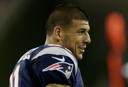 New England Patriots tight end Aaron Hernandez (81) watches the action from the sidelines during their first NFL preseason football game against the New Orleans Saints in Foxborough, Mass. , Friday, Aug. 10, 2012.