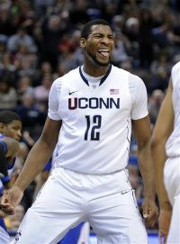 Connecticut's Andre Drummond celebrates in the second half of his team's 69-46 victory over Seton Hall in an NCAA college basketball game in Hartford, Conn. , on Saturday, Feb. 4, 2012.