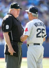 Manager Bobby Valentine of the Boston Red Sox chats with home plate umpire Brian Gorman during a timeout against the Toronto Blue Jays in a MLB game on September 16, 2012 at the Rogers Centre in Toronto, Canada.