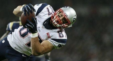 New England Patriots tight end Rob Gronkowski, goes to score during the first half of a NFL football game at Wembley Stadium, London, Sunday, Oct. 28, 2012.