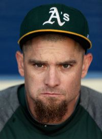 Jonny Gomes #31 of the Oakland Athletics sits in the dugout before Game Four of the American League Division Series against the Detroit Tigers at Oakland-Alameda County Coliseum on October 10, 2012 in Oakland, California.