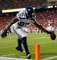 Receiver Kellen Winslow #82 of the Seattle Seahawks lunges for a touchdown during the NFL preseason against the Kansas City Chiefs game at Arrowhead Stadium on August 24, 2012 in Kansas City, Missouri.