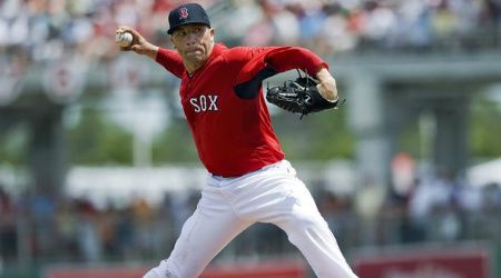 Boston Red Sox starter Alfredo Aceves pitches against the Toronto Blue Jays during the second inning of a spring training baseball game in Fort Myers, Florida, March 29, 2012.