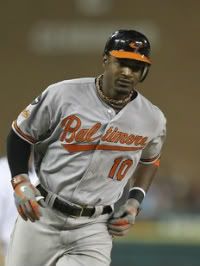 Adam Jones #10 of the Baltimore Orioles hits a two run home run to left field scoring Matt Wieters #32 in the fourth inning during the game against the Detroit Tigers at Comerica Park on September 22, 2011 in Detroit, Michigan.