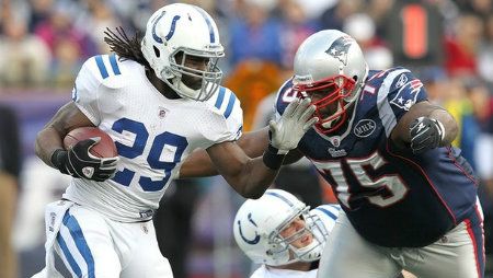 Joseph Addai #29 of the Indianapolis Colts is stopped by Vince Wilfork #75 of the New England Patriots in the second half at Gillette Stadium on December 4, 2011 in Foxboro, Massachusetts.