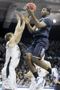 UConn's Andre Drummond floats over Notre Dame guard Scott Martin in the first half as the Huskies beat the Fighting Irish 67-53 at the Purcell Pavilion. 
