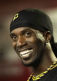 Andrew McCutchen #22 of the Pittsburgh Pirates smiles in the dugout during the Major League Baseball game against the Arizona Diamondbacks at Chase Field on September 20, 2011 in Phoenix, Arizona.