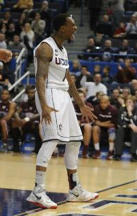 University of Connecticut Huskies guard Ryan Boatright reacts after a dunk during the first half.