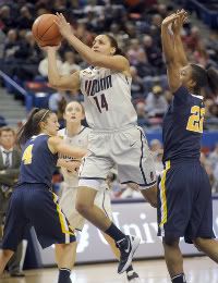 Bria Hartley led UConn past Brooke Hampton, left, and Linda Stepney with 18 points in a 79-60 victory at the XL Center