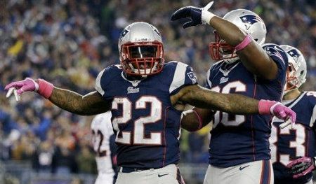New England Patriots running back Stevan Ridley (22) celebrates his touchdown with tight end Daniel Fells (86) and wide receiver Wes Welker (83) in the third quarter of an NFL football game against the Denver Broncos, Sunday, Oct. 7, 2012, in Foxborough, Mass.