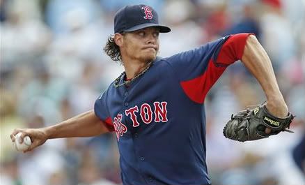 Boston Red Sox starter Clay Buchholz delivers against the Tampa Bay Rays during the first inning of a spring training baseball game in Port Charlotte, Fla., Sunday, March 18, 2012. 