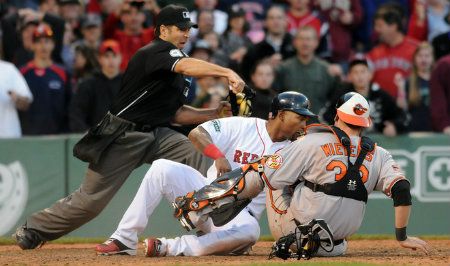 Marlon Byrd #23 of the Boston Red Sox is called out at the plate as Matt Wieters #32 of the Baltimore Orioles applies the tag to end the sixteenth inning at Fenway Park May 6, 2012 in Boston, Massachusetts. 