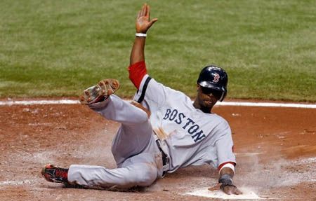  Infielder Pedro Ciriaco #77 of the Boston Red Sox scores a run against the Tampa Bay Rays during the game at Tropicana Field on September 18, 2012 in St. Petersburg, Florida.