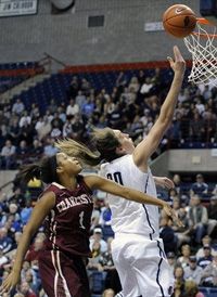 Connecticut's Breanna Stewart, right, drives past Charleston's Alyssa Frye during the first half of an NCAA college basketball game in Storrs, Conn., Sunday, Nov. 11, 2012.