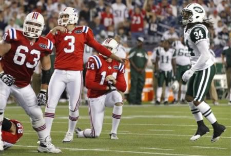 New England Patriots' Stephen Gostkowski (3) and New York Jets defensive back Marquice Cole (34) watch Goskowski's field goal during the fourth quarter of an NFL football game in Foxborough, Mass. , Sunday, Oct. 9, 2011. The Patriots beat the Jets 30-21. At left is New England Patriots guard Dan Connolly (63).