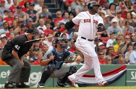 David Ortiz of the Boston Red Sox doubles in a run in the sixth inning against the Tampa Bay Rays at Fenway Park April 15, 2012 in Boston, Massachusetts. Both teams wore the number 42 in honor of Jackie Robinson Day