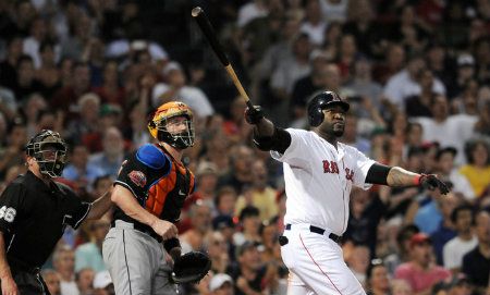 David Ortiz #34 of the Boston Red Sox watches as his grand slam leaves the park in the fourth inning against the Miami Marlins during interleague play at Fenway Park on June 20, 2012 in Boston, Massachusetts.