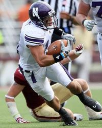 Jeremy Ebert #11 of the Northwestern Wildcats carries the ball in the second half against the Boston College Eagles on September 3, 2011 at Alumni Stadium in Chestnut Hill, Massachusetts.