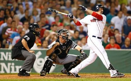  Adrian Gonzalez #28 of the Boston Red Sox hits a two run double against the Chicago White Sox in the 6th inning during the game on July 18, 2012 at Fenway Park in Boston, Massachusetts.
