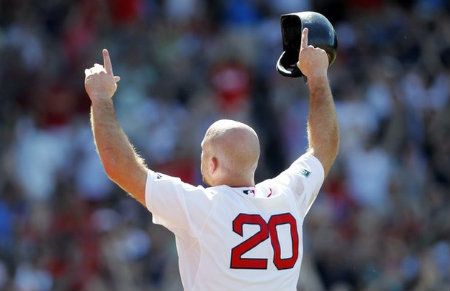 Boston Red Sox's Kevin Youkilis (20) raises his arms to the crowd as he comes off the field after hitting a triple and being replaced with a pinch-runner in the seventh inning of a baseball game against the Atlanta Braves in Boston, Sunday, June 24, 2012.