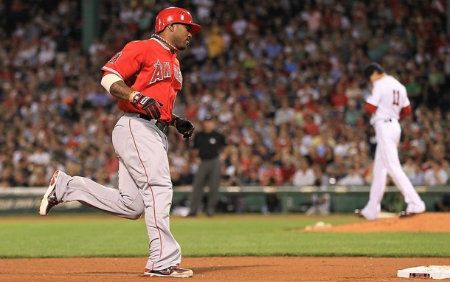 Howard Kendrick #47 of the Los Angeles Angels rounds the bases on a home run he hit off of Clay Buchholz #11 of the Boston Red Sox in the sixth inning against the Boston Red Sox at Fenway Park on August 22, 2012 in Boston, Massachusetts.