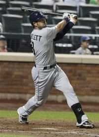 San Diego Padres' Jason Bartlett follows through on an RBI double during the fifth inning of a baseball game against the New York Mets on Tuesday, Aug. 9, 2011, in New York.