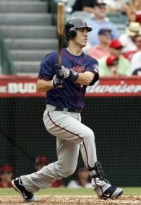 Minnesota Twins' Joe Mauer watches his home run against the Los Angeles Angels during the fourth inning of a baseball game in Anaheim, Calif. , Sunday, Sept. 4, 2011.