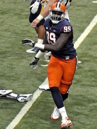 Syracuse's Chandler Jones (99) celebrates after sacking West Virginia quarterback Geno Smith during the second quarter of an NCAA college football game in Syracuse, N.Y.