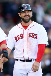 Kelly Shoppach #10 of the Boston Red Sox celebrates after he scored in the 8th inning against the Tampa Bay Rays during the home opener on April 13, 2012 at Fenway Park in Boston, Massachusetts.