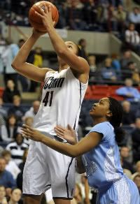 UConn's Kiah Stokes goes up for a shot over North Carolina's She'la White. Stokes recorded her first ever double-double with 11 points and 11 rebounds in only 14 minutes. 
