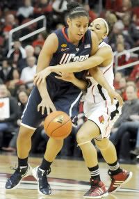 UConn freshman Kaleena Mosqueda-Lewis faces some tight defensive coverage by Louisville forward Bria Smith Tuesday night at Louisville.